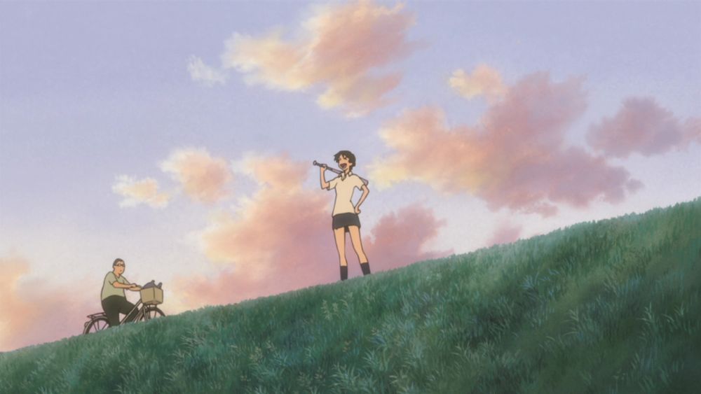 Makoto standing on a riverbank with a baseball bit laughing