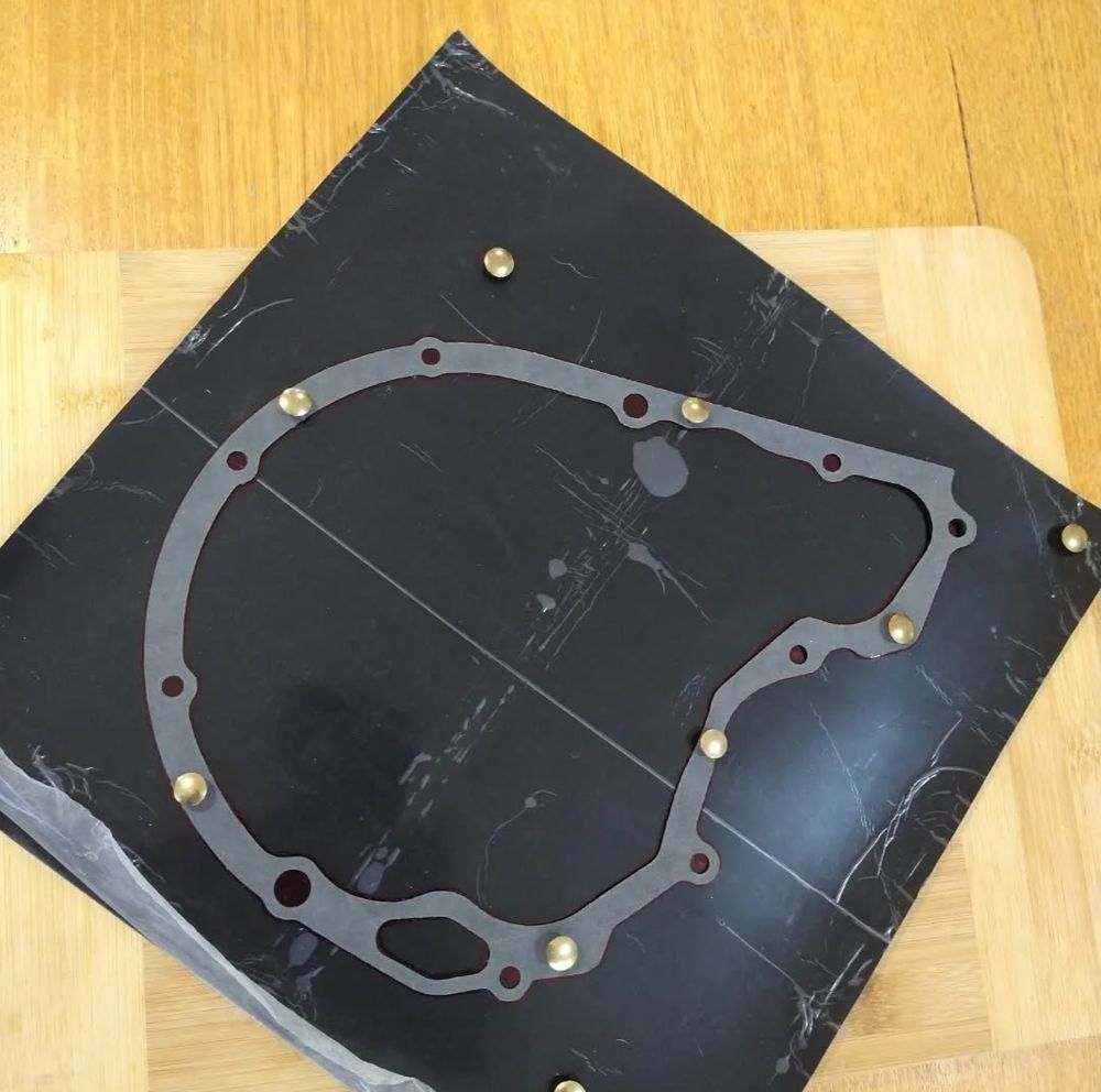 Paper gasket used as template for silicone gasket.