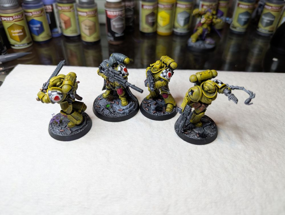A Lamenters Angels of Death Kill Team for Warhammer 40k, resplendent in their yellow power armor and sad to the core.