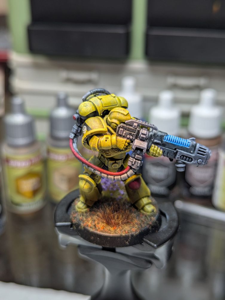 A Lamenters Space Marine Hellblaster, 3rd Company, 9th Squad in his yellow power armor, looking menacing with a backpack fed plasma gun