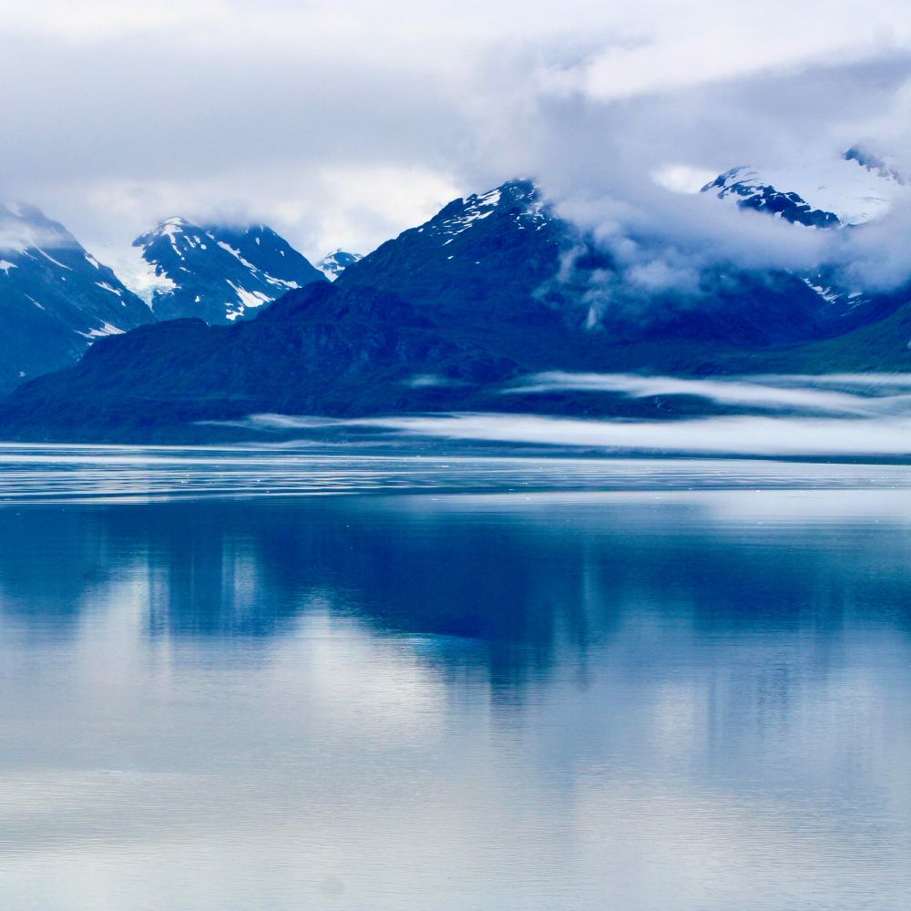 Mountain View with reflection in still water.