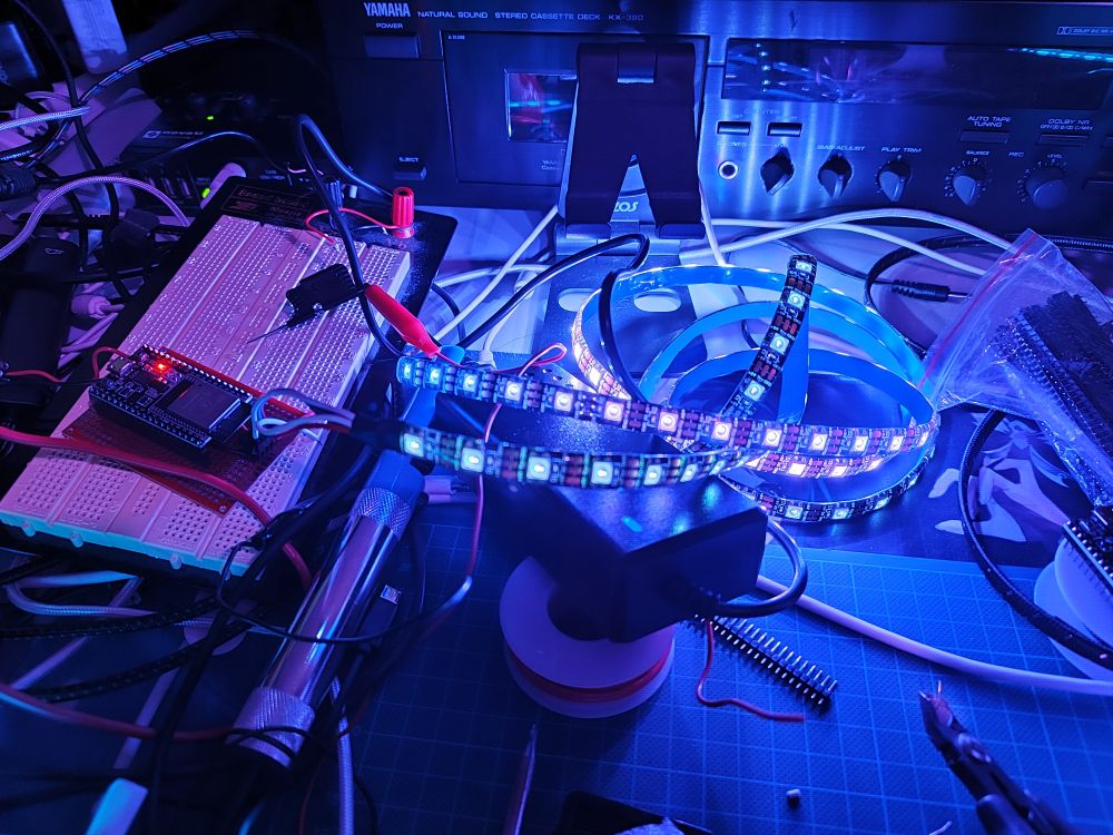 LED strip connected to ESP32 and lit up in blue/purple