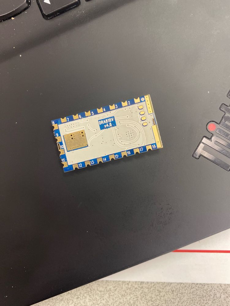 DRA818V IC on a laptop palm rest