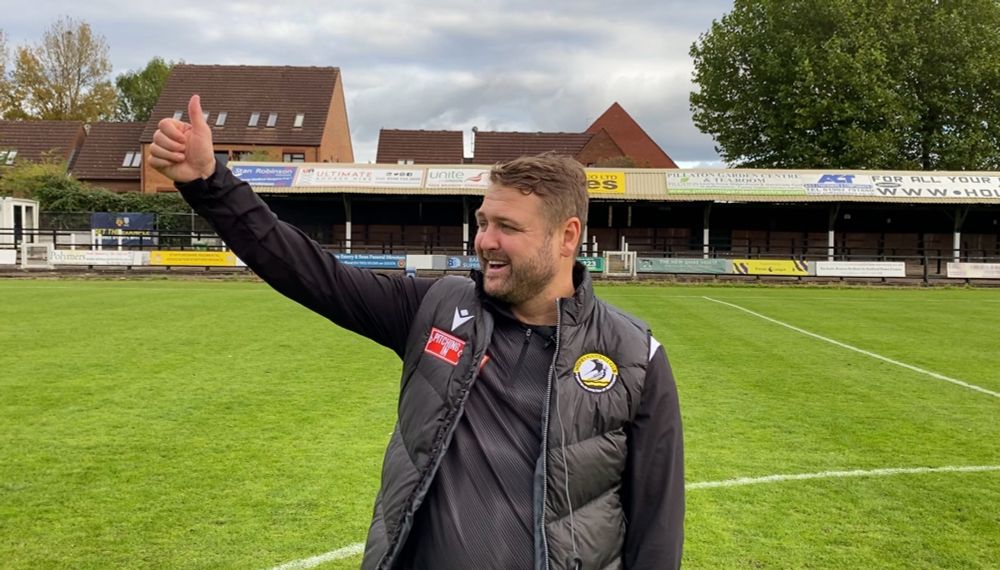 Widnes FC manager Michael Ellison gives a thumbs up during a post-match interview. 