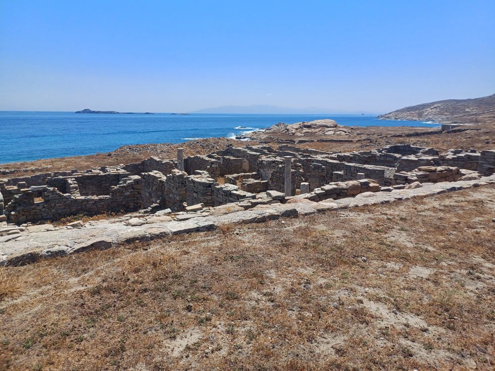 Landscape with archaeological ruins and blue see on the background