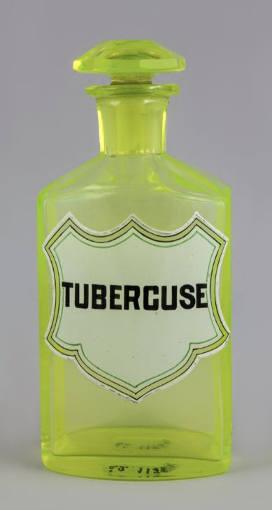 green (uranium) bottle with label reading 