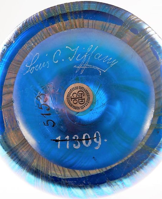 cup from bottom, with Louis C Tiffany signed across the glass