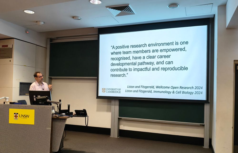 Prof Adrian Liston presenting his definition of a positive research environment