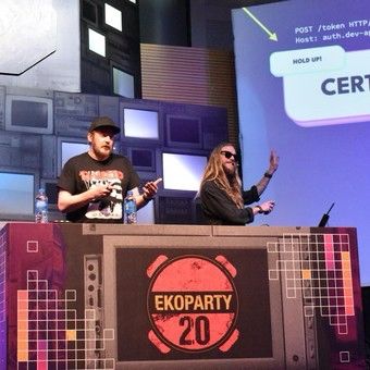 Joohoi and stök presenting their research around bitflips on the main ekoparty stage, 