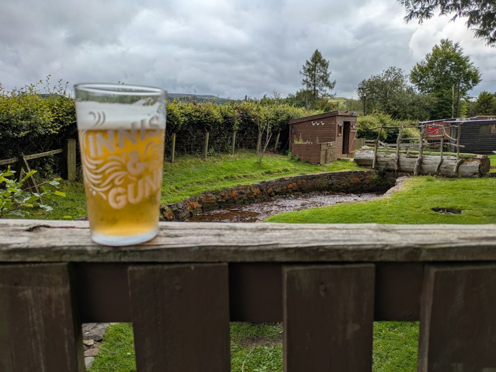 A mediocre beer perched on a fence at the pygmy goat enclosure at The Beech Tree Inn near Balmaha.