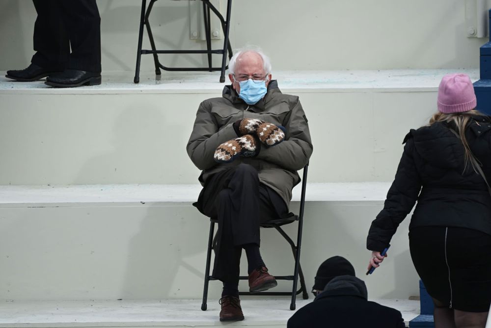 iconic bernie sanders meme where he's sitting on chair with mittens