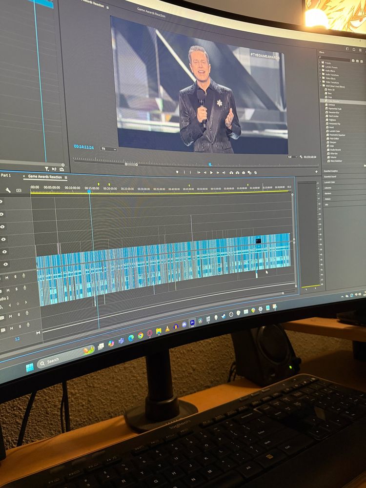 A computer monitor with Adobe Premiere open on it.  