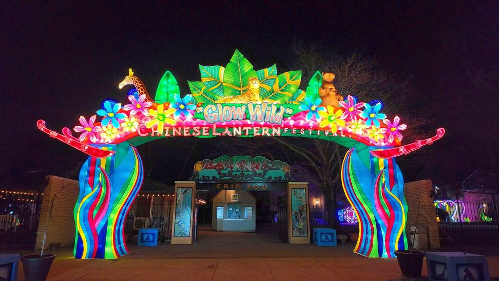 Lighted lantern across entrance to Erie Zoo that says Glow Wild Chinese Lantern Festival