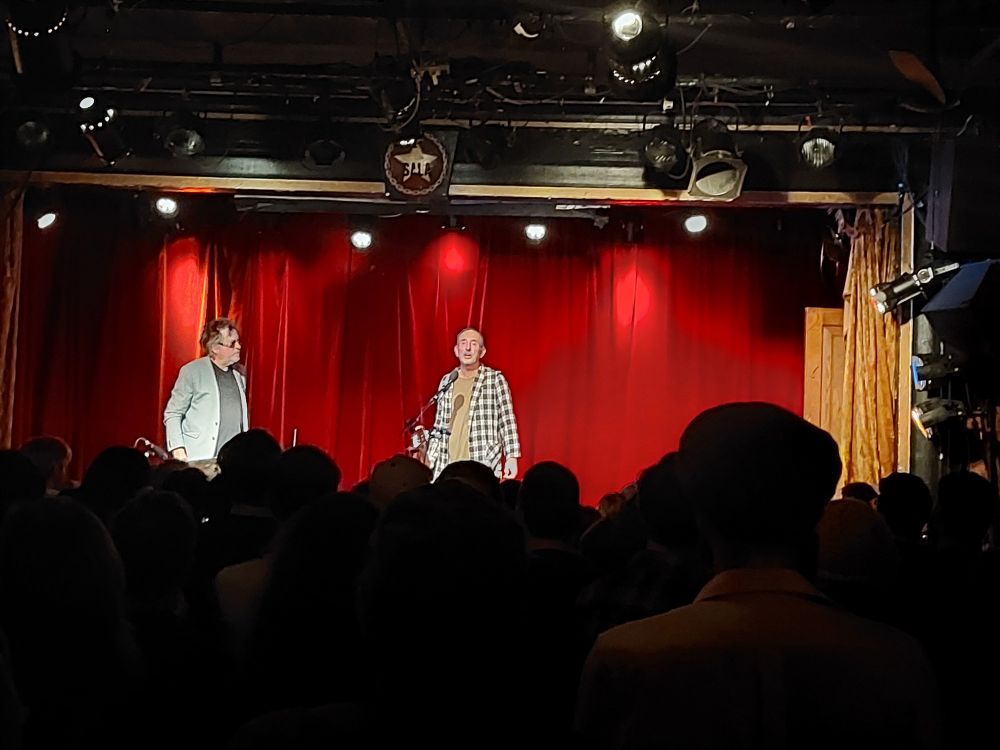 Two men on stage at the Sala Rosa, left drummer Tommy Larkin, right Jonathan Richman