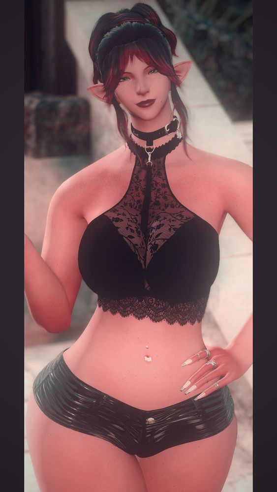 A zoomed in picture of the previous shot, you can see her green eyes in this, and the cute little paw shaped navel ring.