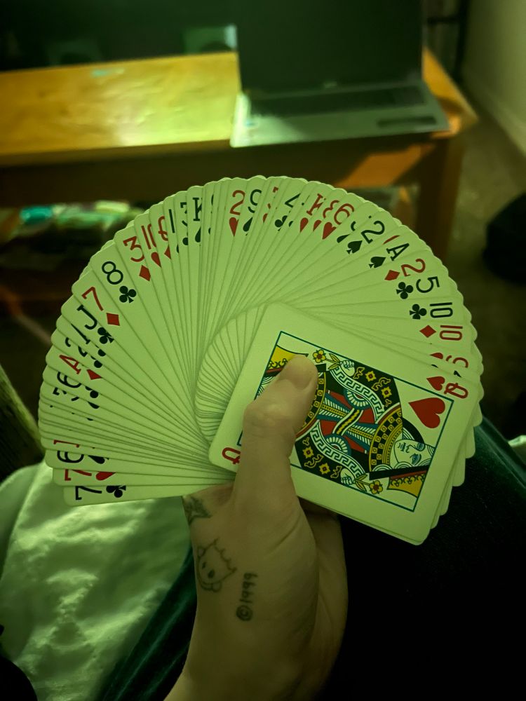 A deck of cards fanned out in my hand almost perfectly.