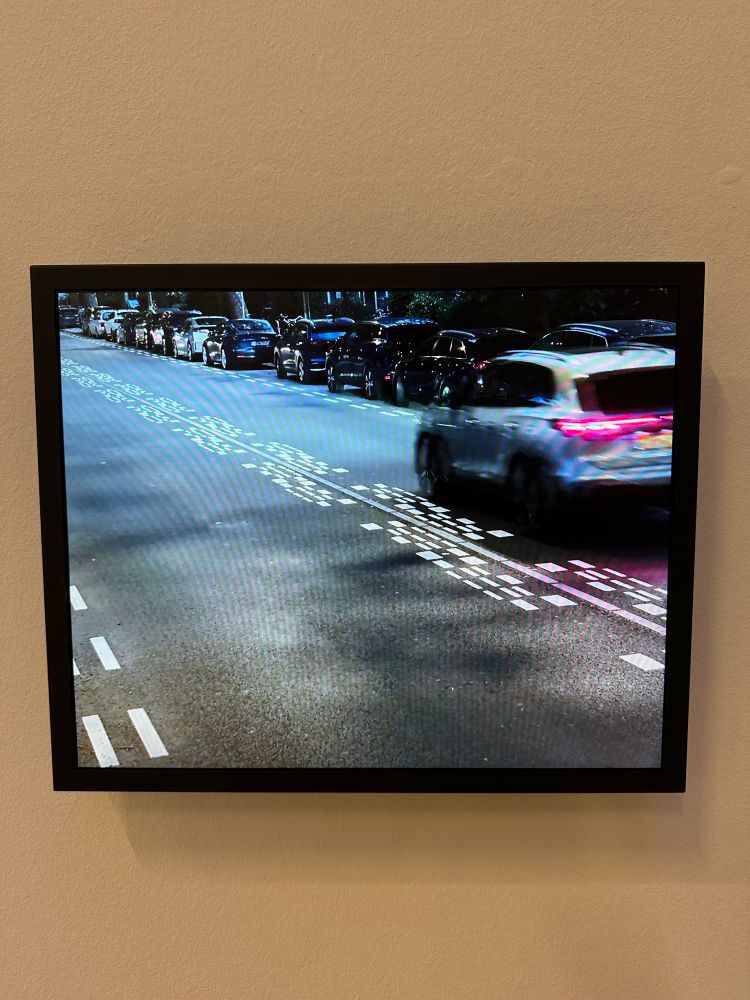 Video screen shows road surface with these 30 lines in the middle, passing car