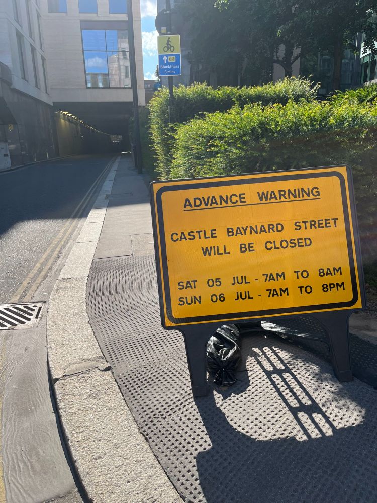 Yellow warning signs "Advance Warning Castle Baynard Street will be closed Sat 5 Jul 7am-8pm Sun 6 Jul 7am-8pm"