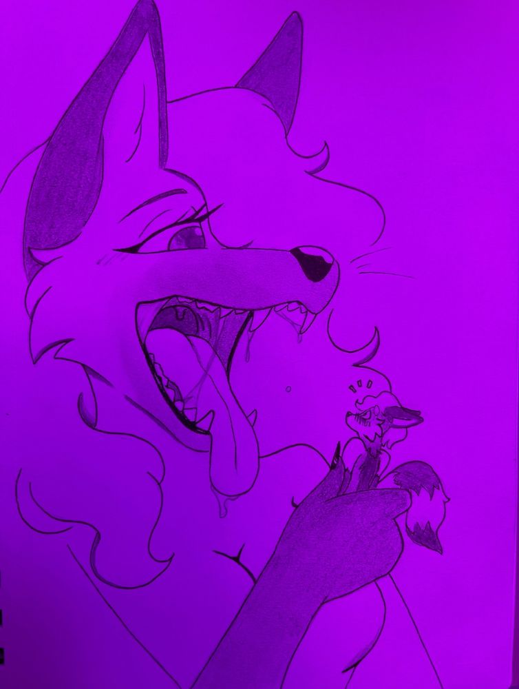 Kat with her mouth open wide holding her tiny mate ready to have a bite~