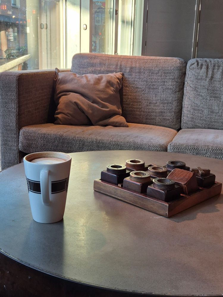 A cup of coffee on a table in a coffee shop