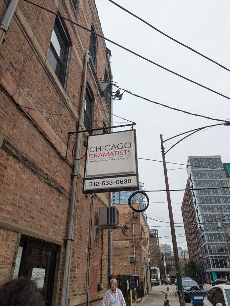 A sign above a sidewalk that reads "Chicago Dramatists"