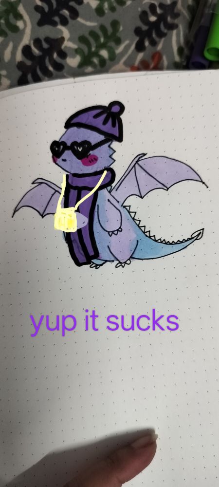 Dragon wearing a cap, glasses and muffler and a cast and text that reads yup it sucks 