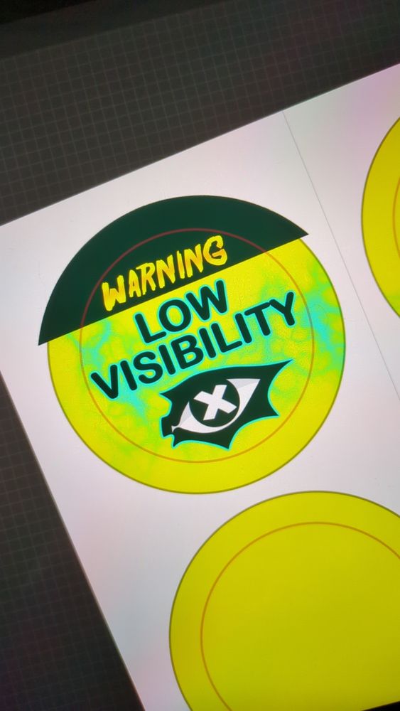 Badge design, it reads, warning, low visibility
