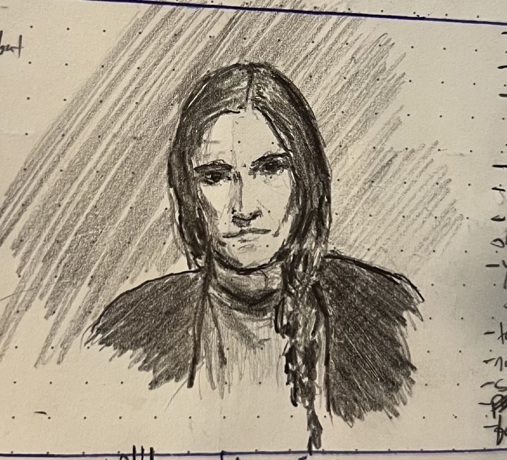 Pencil sketch of a Latina woman staring down the viewer