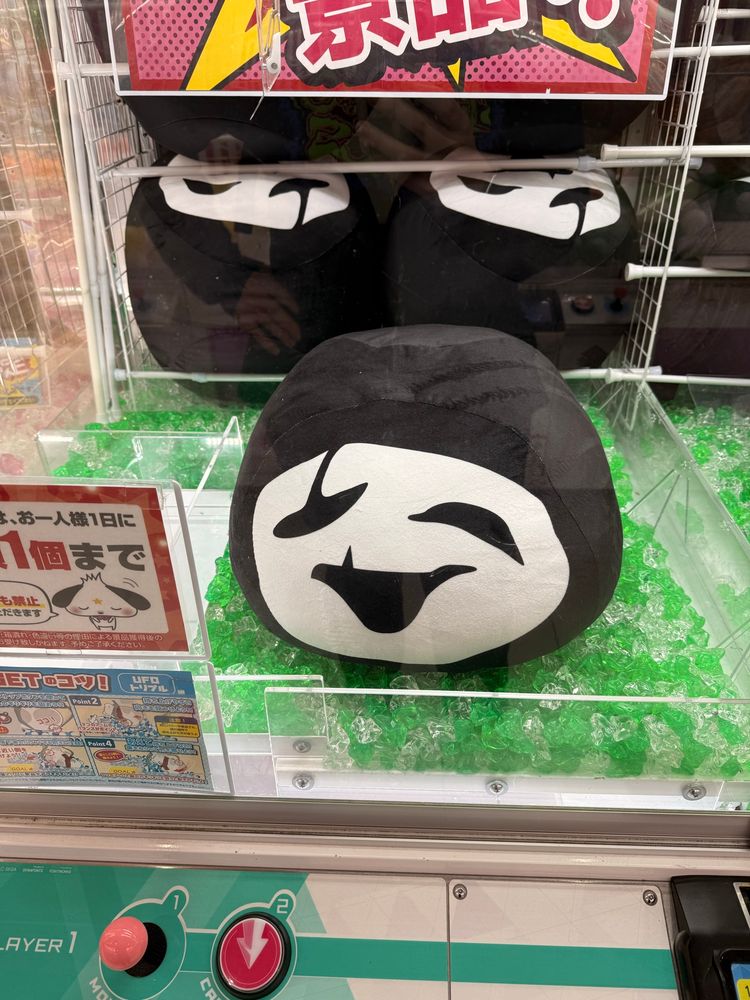 uboa creature inside a claw machine 