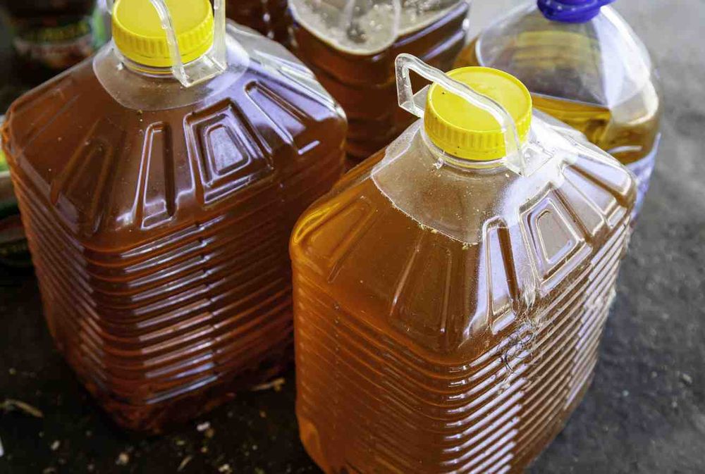 Jars filled with used oil.