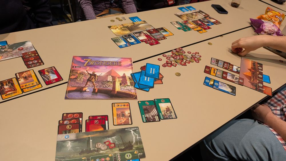 7 wonders instructions booklet, player boards, and cards