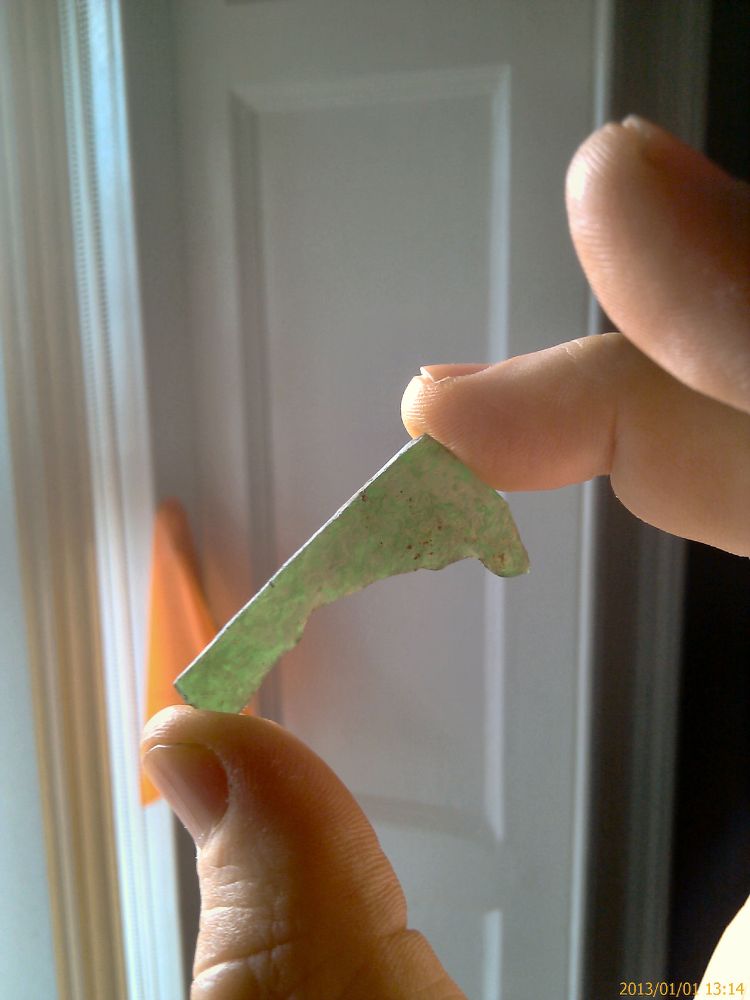 Piece of greenish and translucent glass, likely from a window of the former Holywood Abbey, demolished in 1777.

(c) 2012 Sean F. Johnston