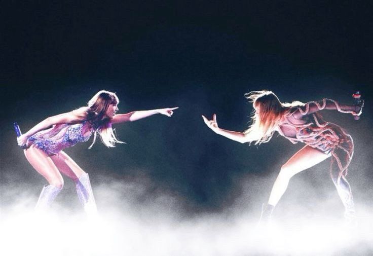 an altered photo showing taylor from the lover era set pointing at taylor from the rep era set 