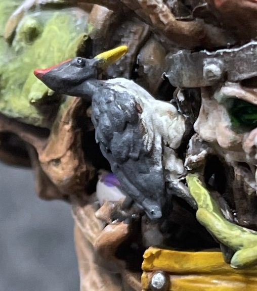 He has a Ton of detail; this is a zoom in on the woodpecker on his cheek