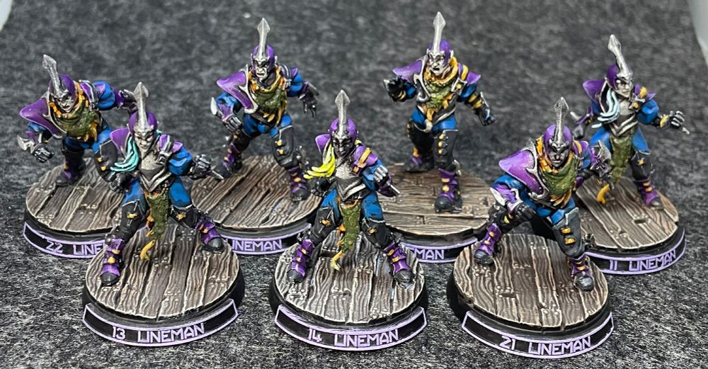 Seven painted Dark elf linemen for Blood Bowl