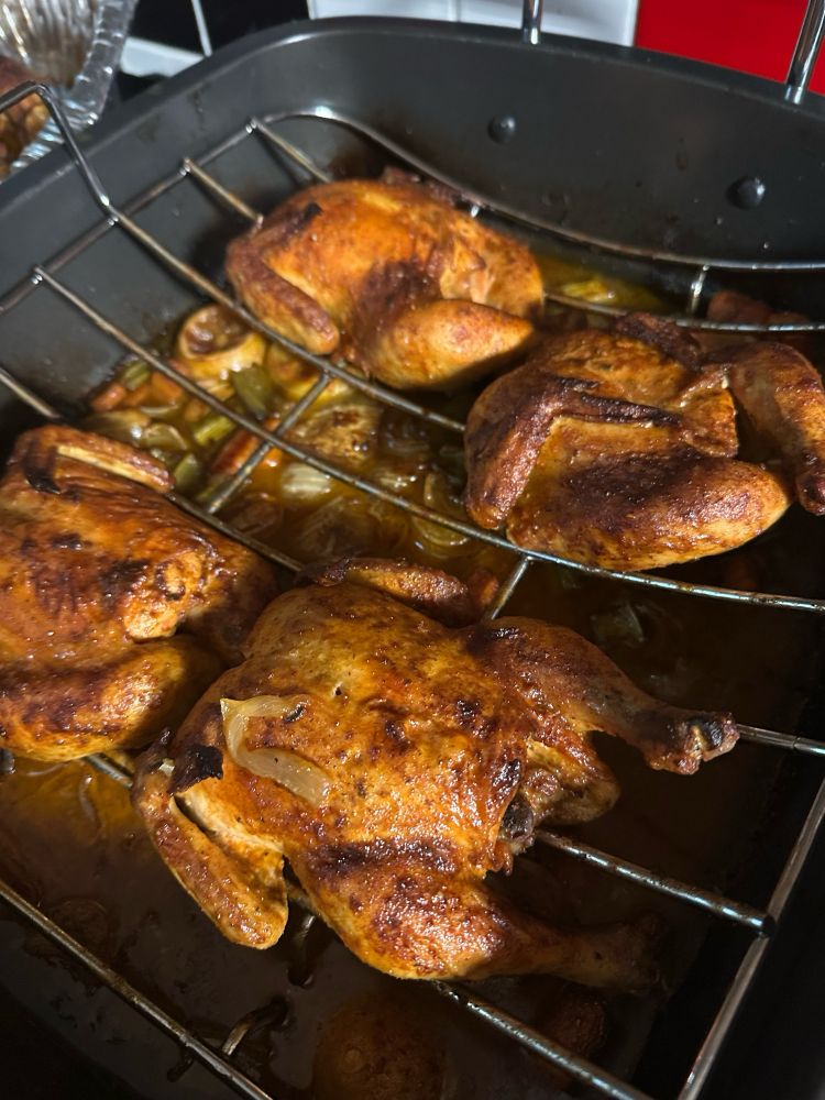 The most perfect, juicy little Cornish hens in a roasting rack