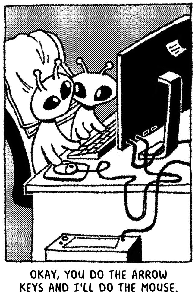 Two little aliens sitting in a single chair at a computer desk. One says to the other, "Okay, you do the arrow keys and I'll do the mouse."