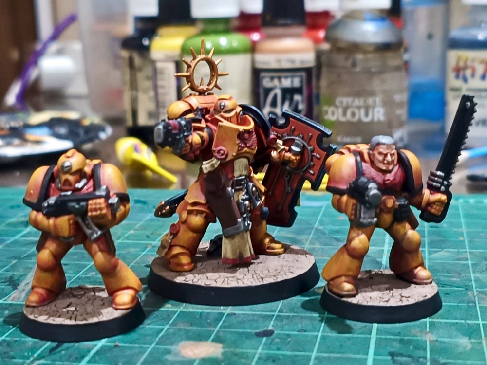 Side by side with some very squat 2nd edition space Marines in the same colors