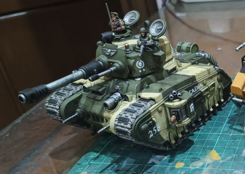 Painted model of an Imperial Guard Rogal Dorn battle tank in green and khaki camo colors
