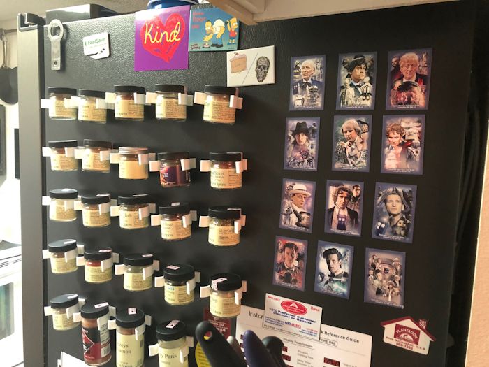 Photo: Side of fridge covered with magnetic spice-bottle hooks filled with almost all Penzeys' spice bottles (and some Doctor Who magnets). 