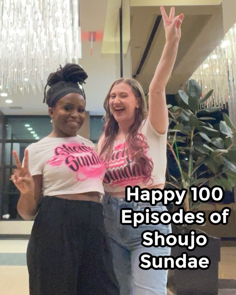 Chika & Giana stand indoors under a chandelier, both wearing white cropped t-shirts with "Shoujo Sundae" in bold pink and black lettering. They are celebrating with peace signs, and Giana has her arm raised in the air. Overlaid text reads, "Happy 100 Episodes of Shoujo Sundae."
