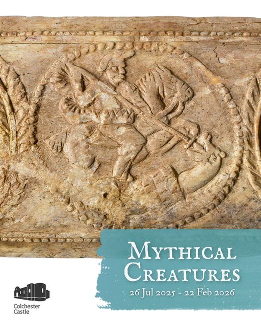 A carved bone relief depicts a mounted warrior slaying a dragon with a spear. The figure is enclosed within a circular border and surrounded by decorative foliage motifs. The weathered surface suggests historical age. A blue banner at the bottom reads: “Mythical Creatures, 26 Jul 2025 – 22 Feb 2026.” The Colchester Castle logo is displayed in the lower left corner.