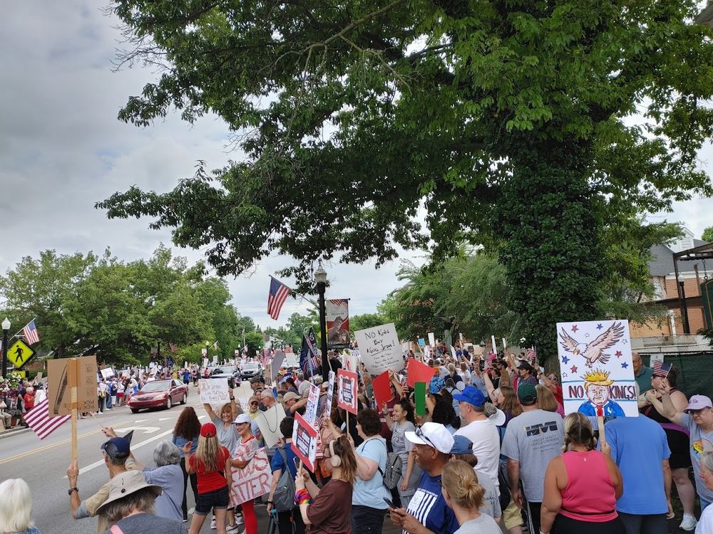 A large crowd of protesters carrying signs