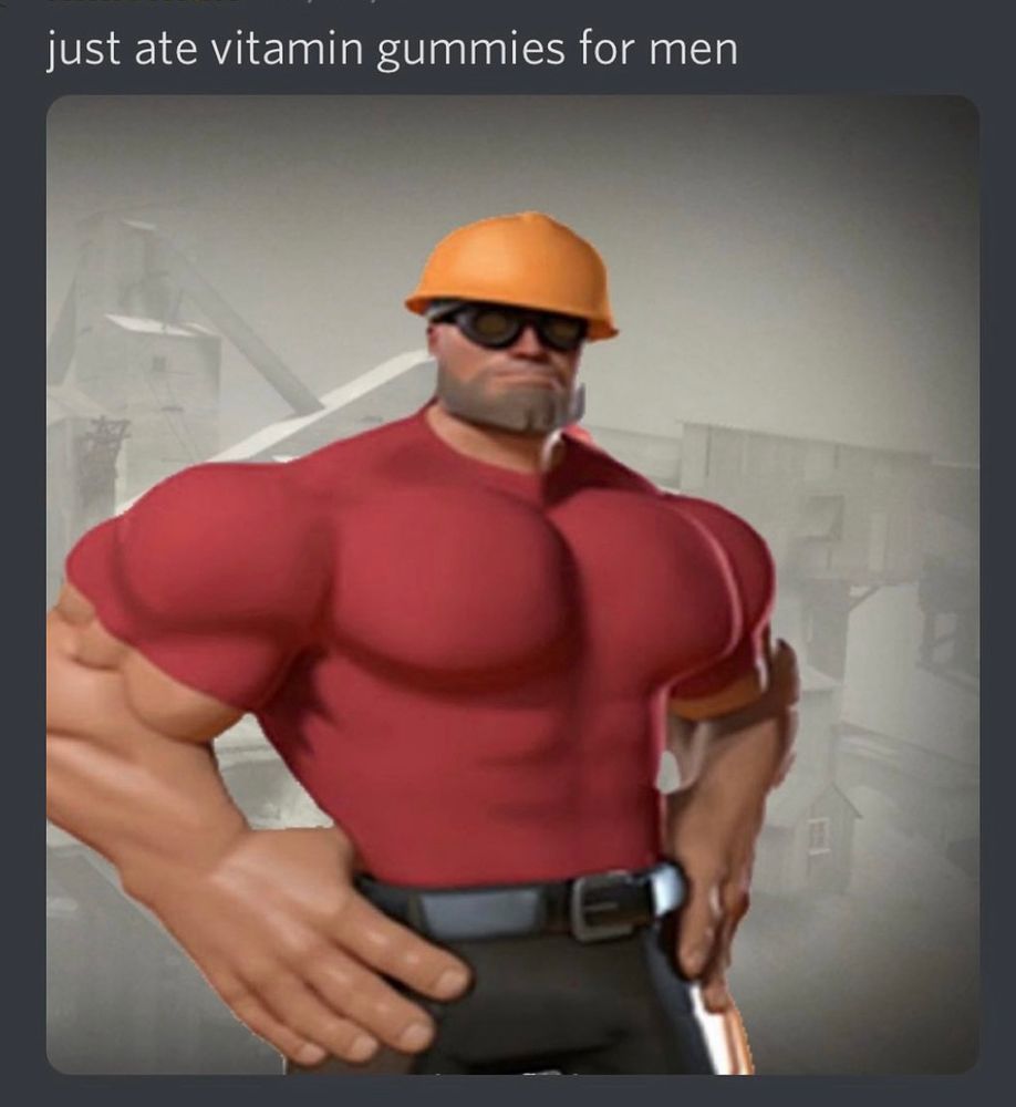 A very buff Engineer from the game Team Fortress 2 stands with his hands on his hips. The text reads, “just ate vitamin gummies for men,”.