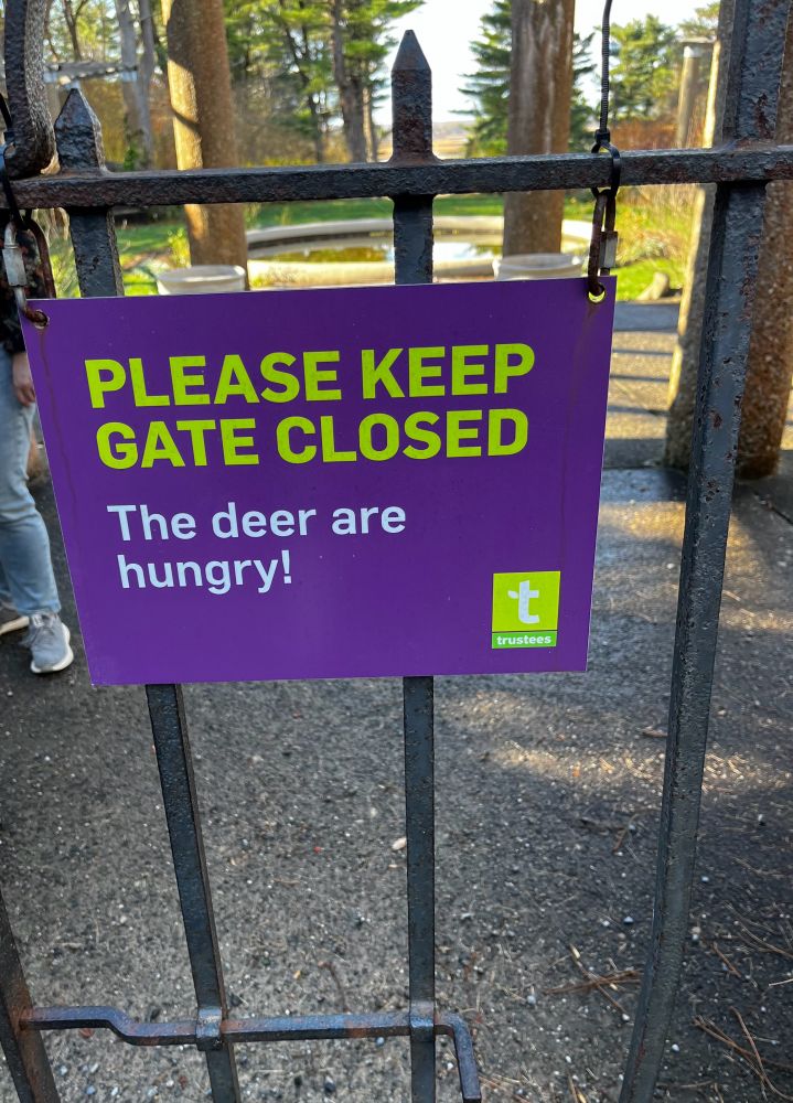 Sign on a gate leading into a garden, which is actually undergoing renovation: sign reads “PLEASE KEEP THIS GATE CLOSED. The deer are hungry!”