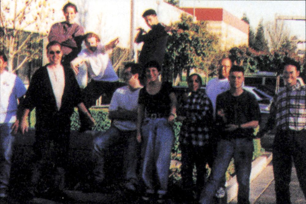 Bunch of happy looking folks standing in front of what must be the Ocean of America offices in late 90s