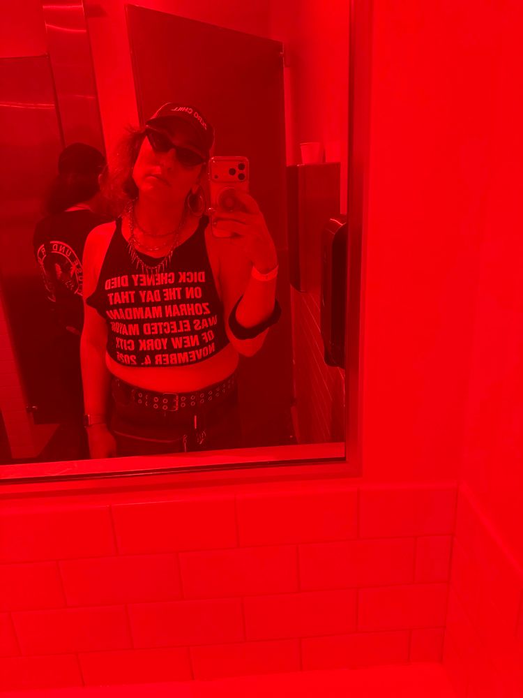 Bathroom mirror selfie in red lighting 