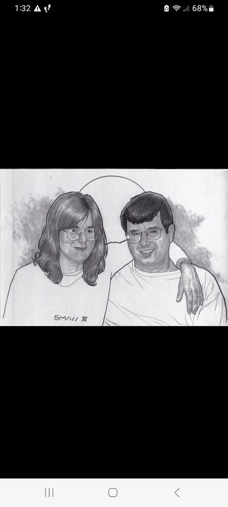 A beautiful pencil drawing of my wife and I. 