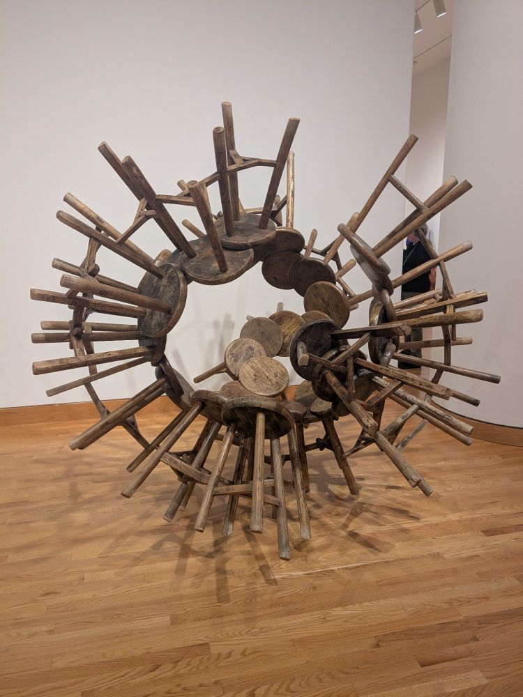 Qin (?) dynasty wood furnishings fused with modern carpentry techniques to form 40 stools all seamlessly attached together  
