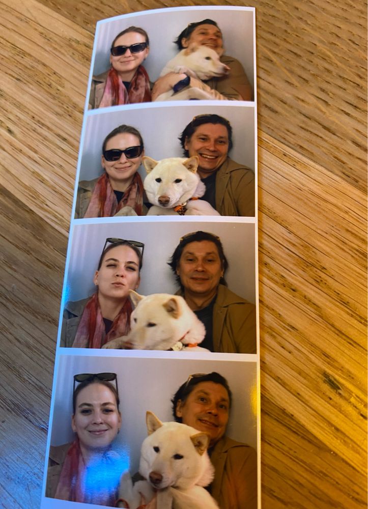 a photos with a dog and two persons